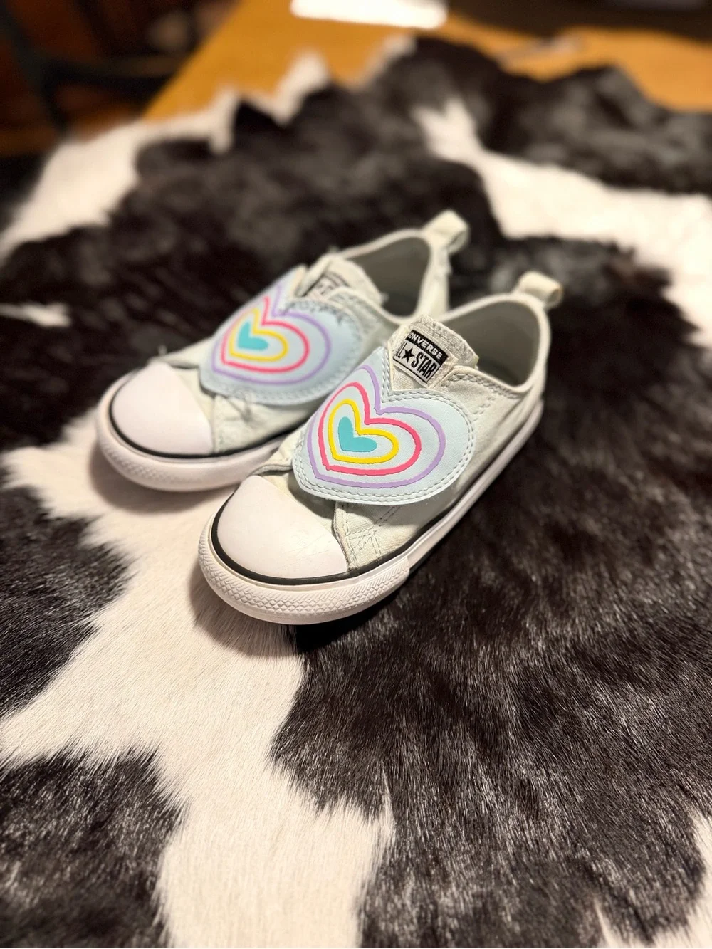 Converse Kids White Slip-On Sneakers with Rainbow Heart Velcro Patch